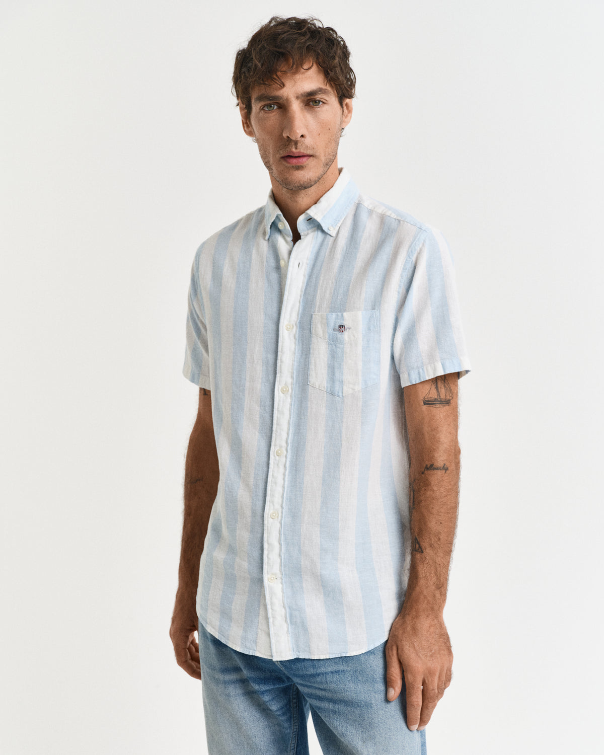 MODEL WEARING REG COTTON LINEN STRIPE SS SHIRT