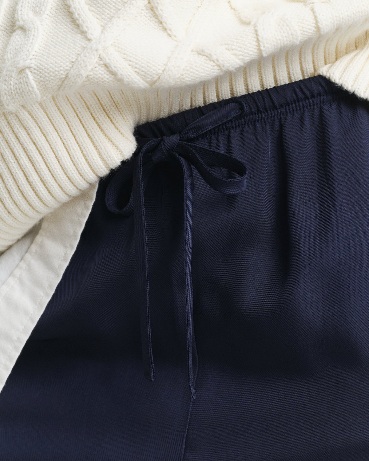 MODEL WEARING FLUID DRAWSTRING PANTS