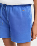 MODEL WEARING REG SHIELD SHORTS