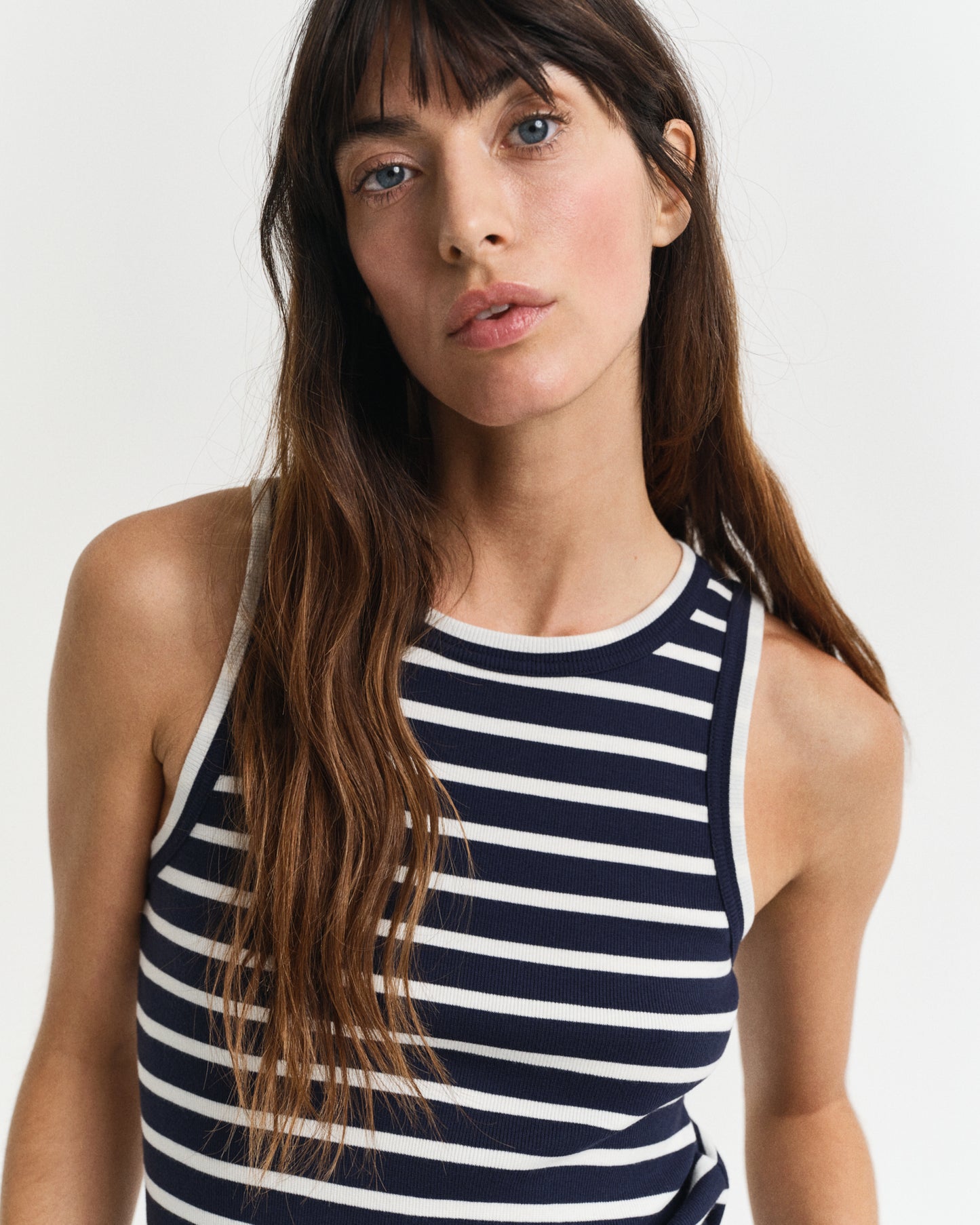 MODEL WEARING STRIPED TANK TOP