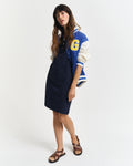 MODEL WEARING SHIELD SS PIQUE POLO DRESS