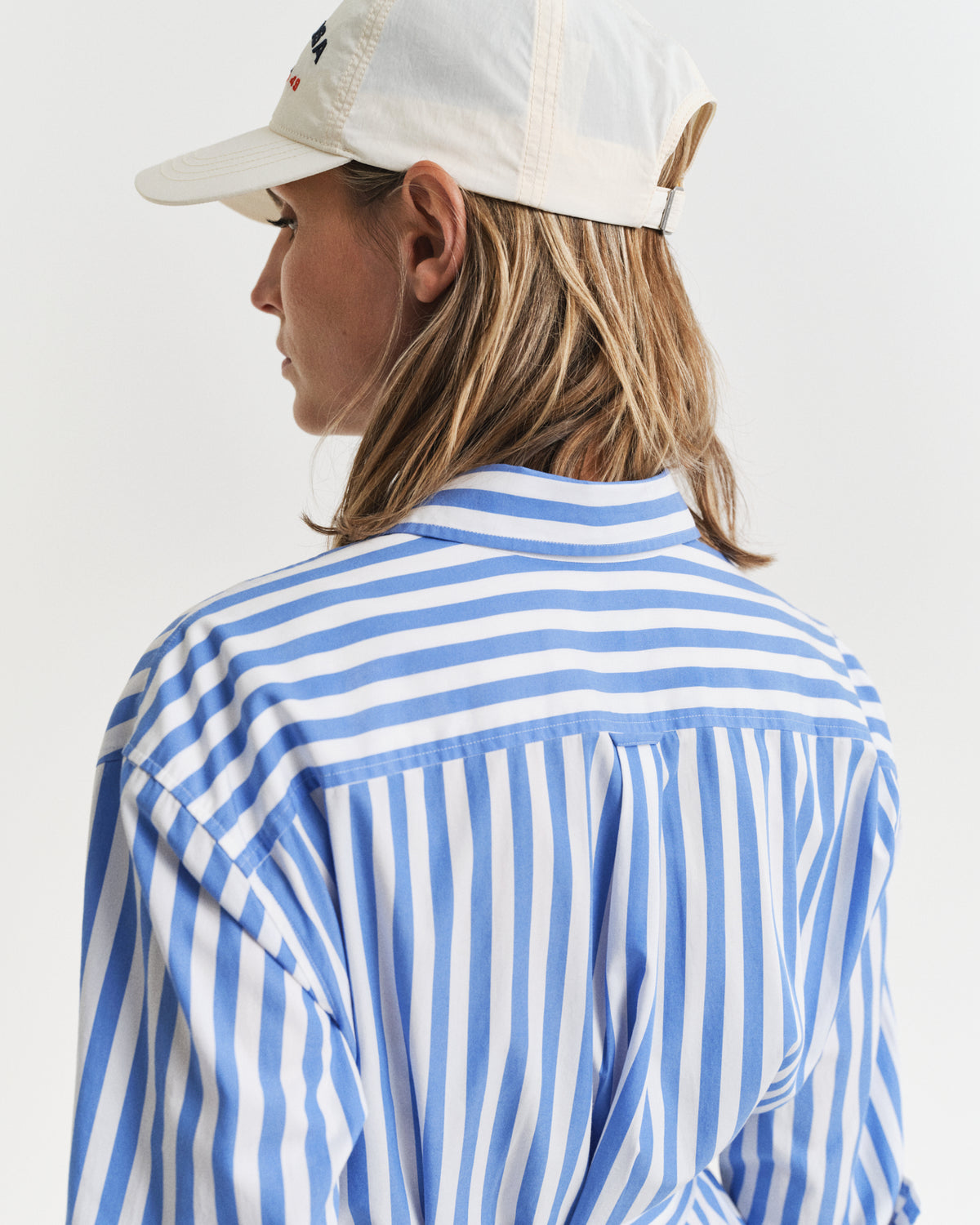 MODEL WEARING REL STRIPED POPLIN SHIRT DRESS