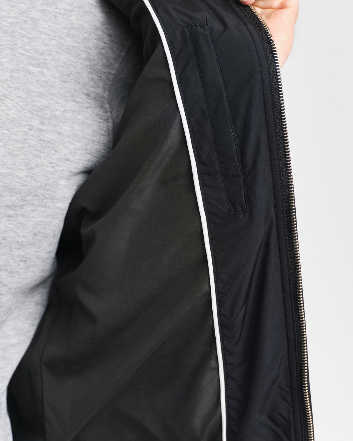 MODEL WEARING QUILTED WINDCHEATER VEST