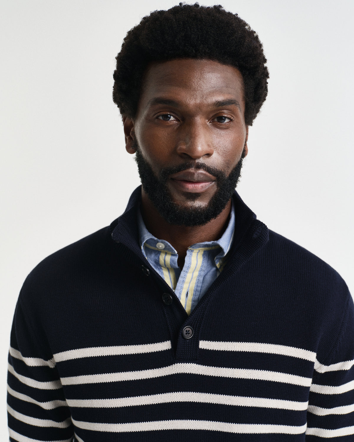 MODEL WEARING STRIPED COTTON HALF BUTTONED NECK