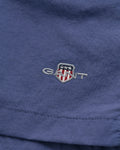 DUSTY NAVY, SWIM SHORTS, FLAT-LAY BY GANT AU.