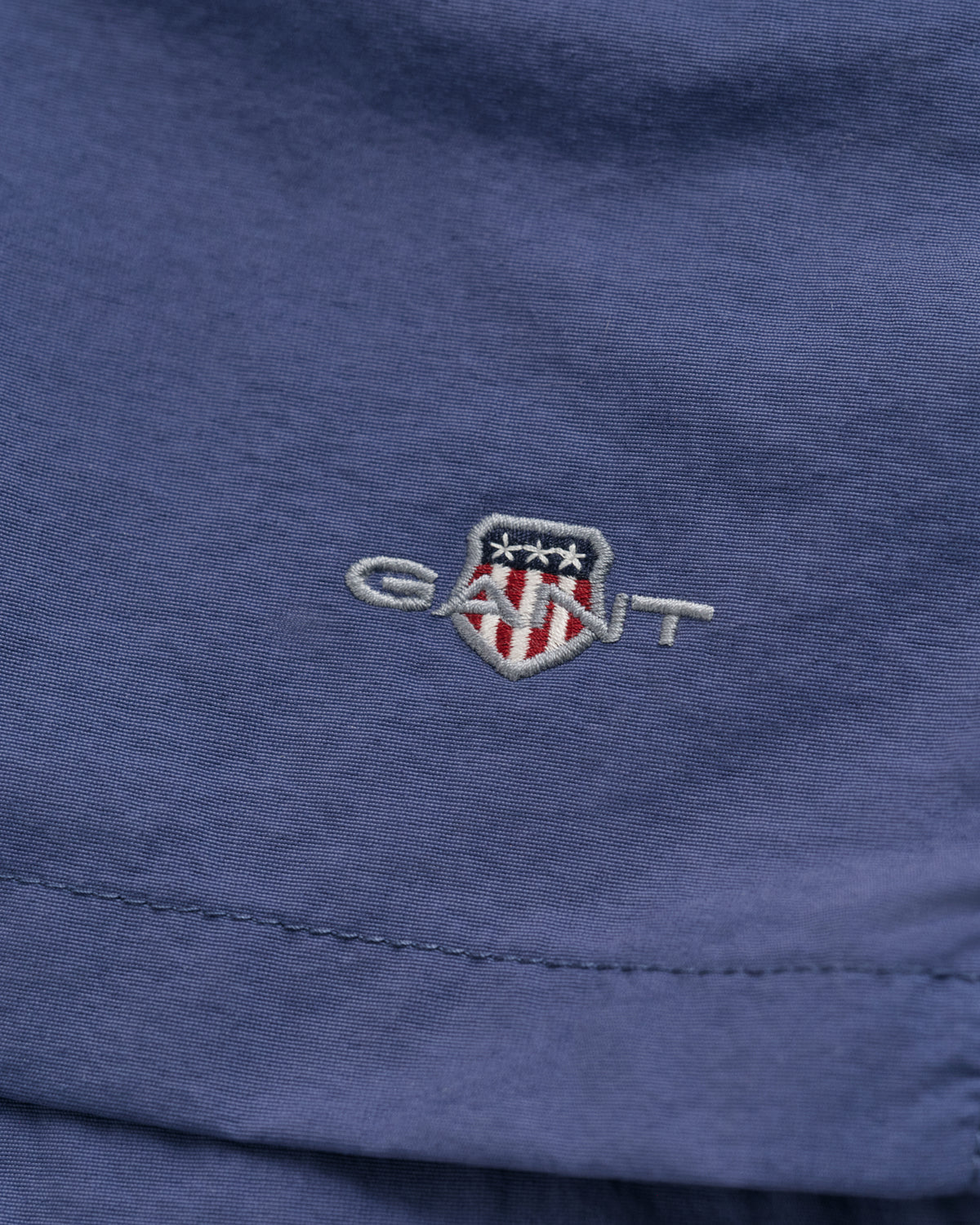 DUSTY NAVY, SWIM SHORTS, FLAT-LAY BY GANT AU.