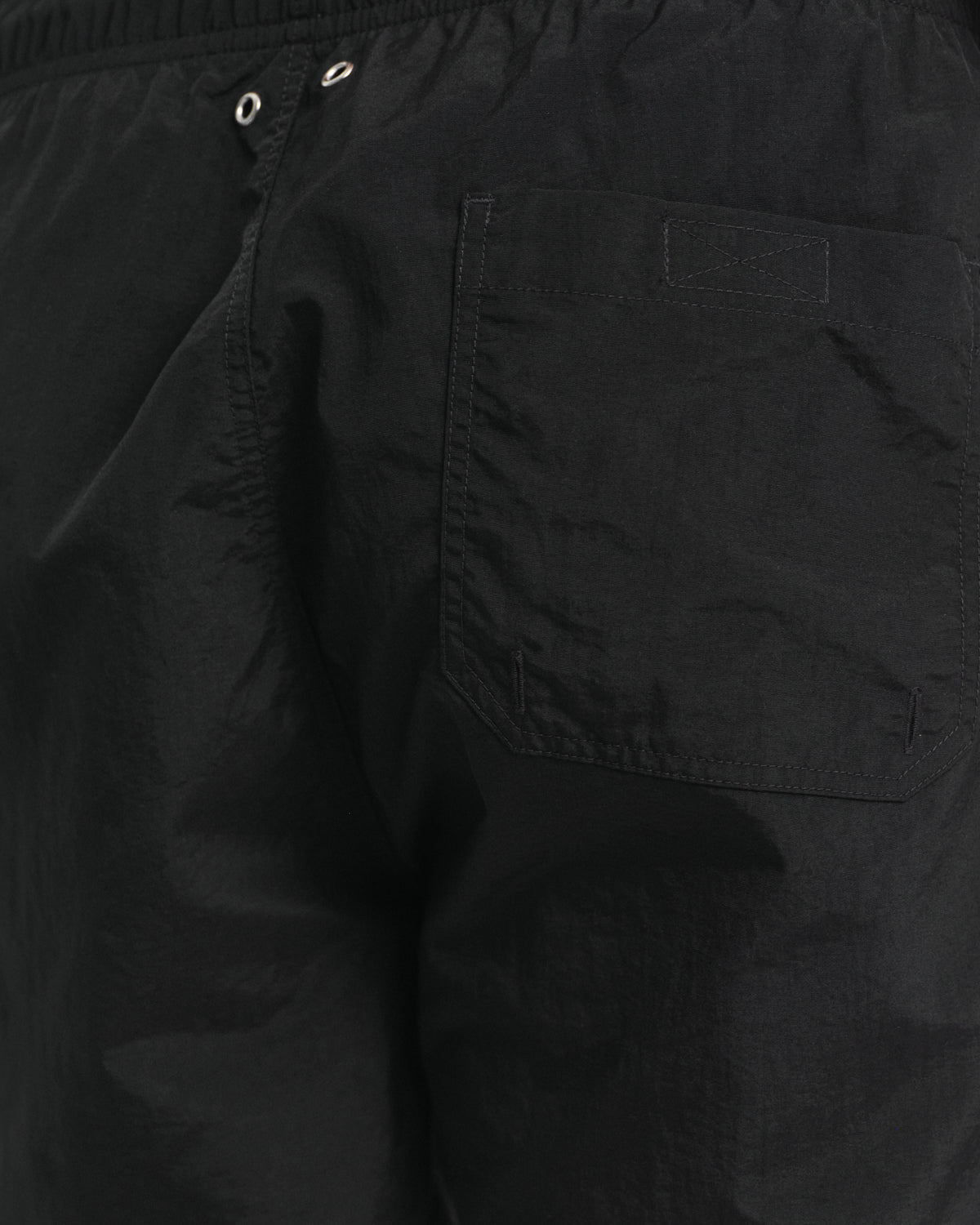 MODEL WEARING SWIM SHORTS