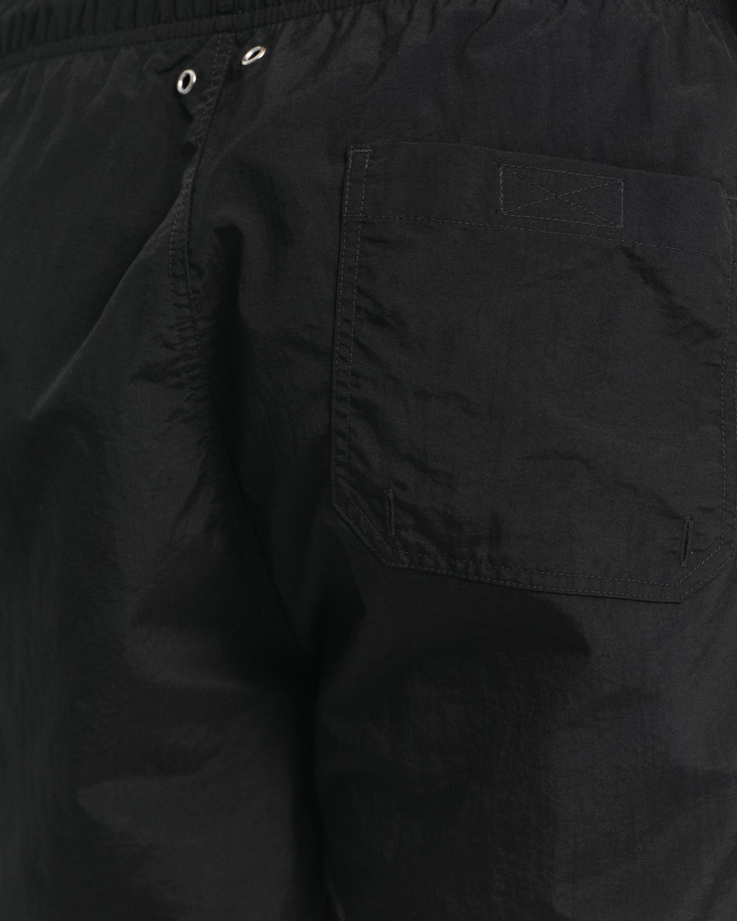 MODEL WEARING SWIM SHORTS