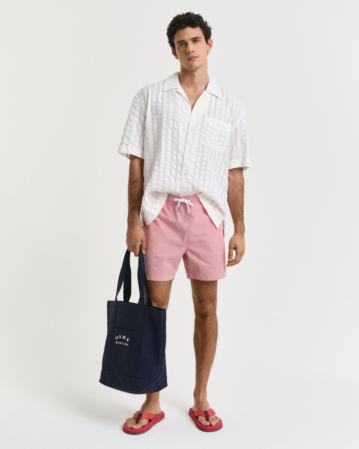 RUBY RED, SEERSUCKER SWIM SHORTS BY GANT AU.