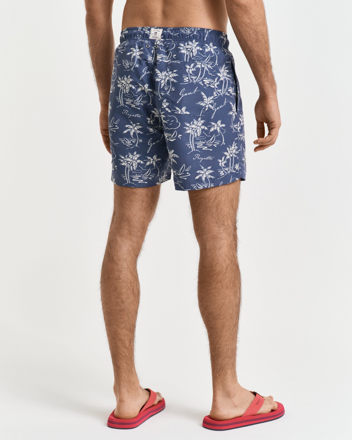 DUSTY NAVY, ISLAND PRINT SWIM SHORTS, BACK-VIEW BY GANT AU.