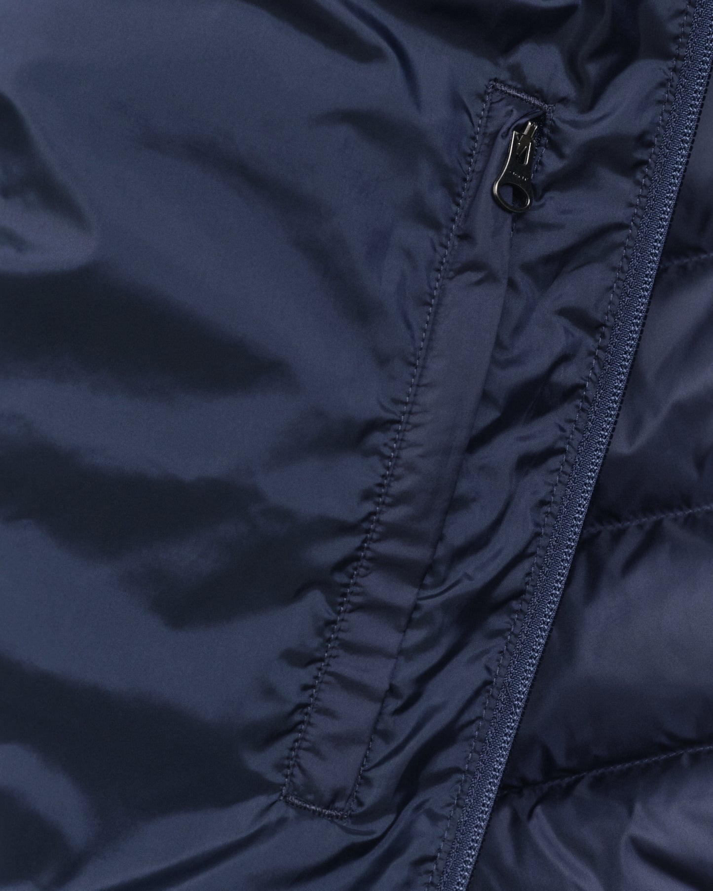 MODEL WEARING LIGHT DOWN JACKET