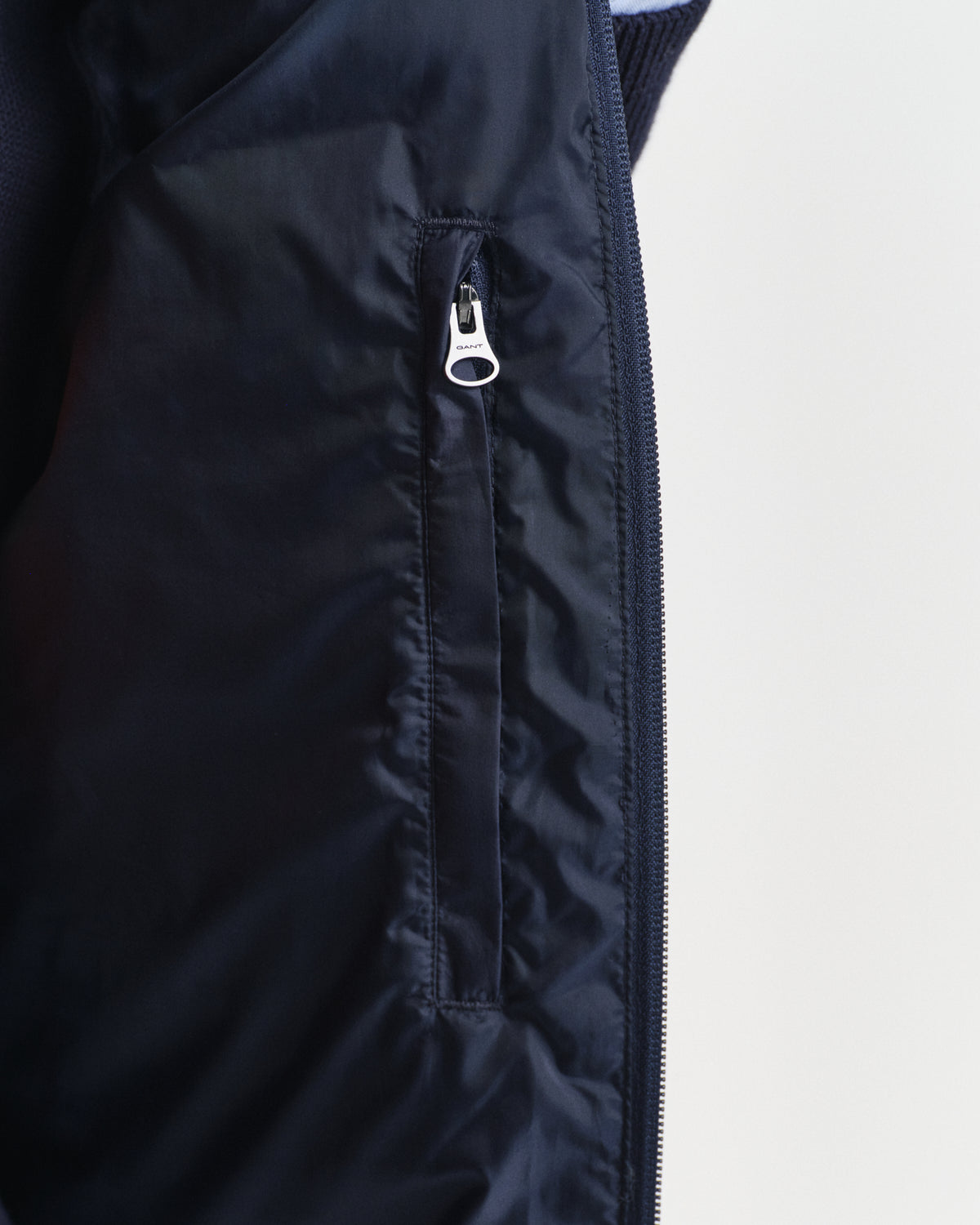 MODEL WEARING LIGHT DOWN VEST