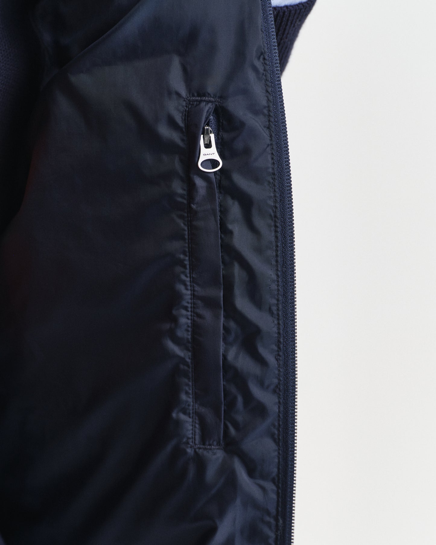 MODEL WEARING LIGHT DOWN VEST
