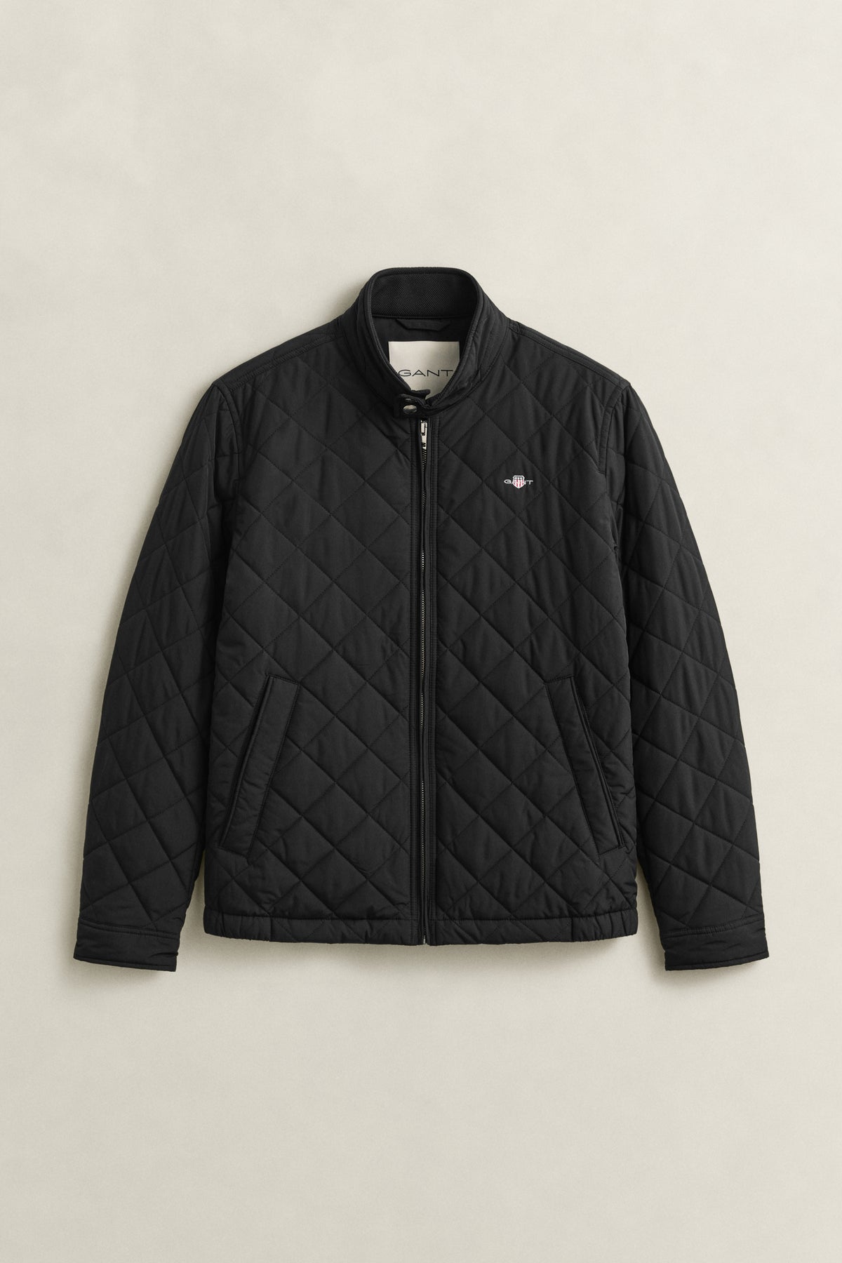 BLACK, QUILTED WINDCHEATER, FLAT-LAY BY GANT AU.