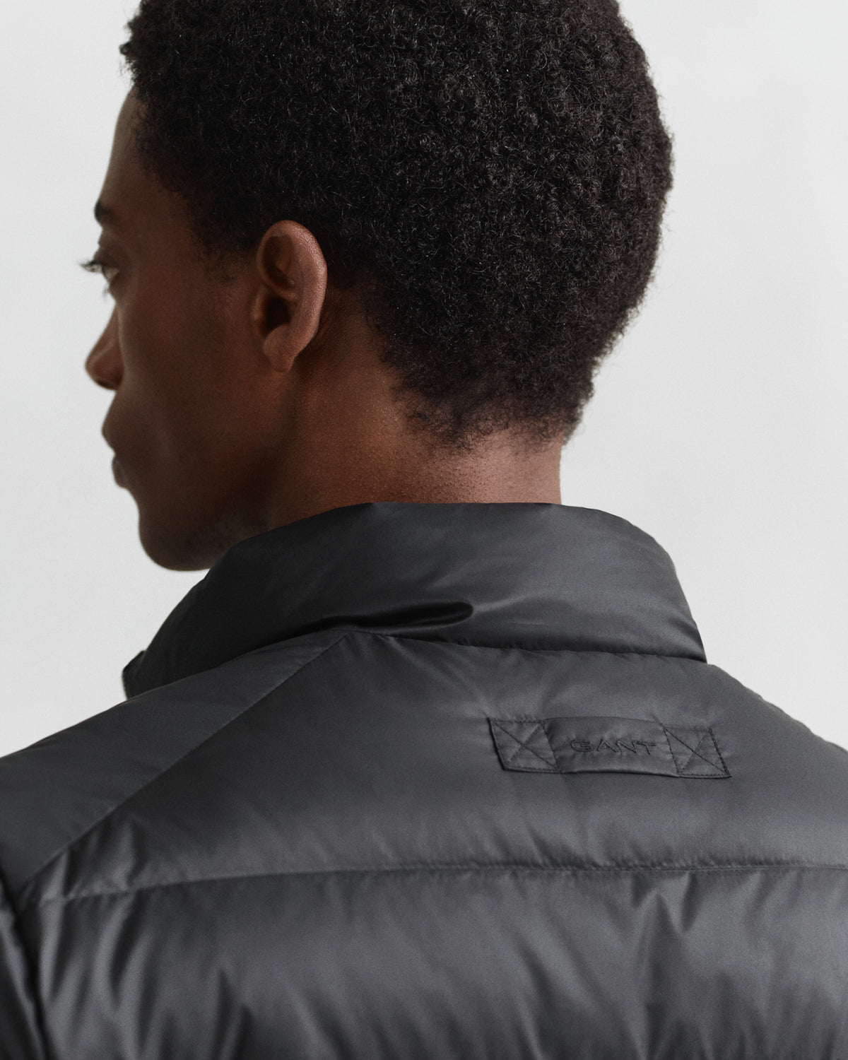 MODEL WEARING LIGHT DOWN JACKET