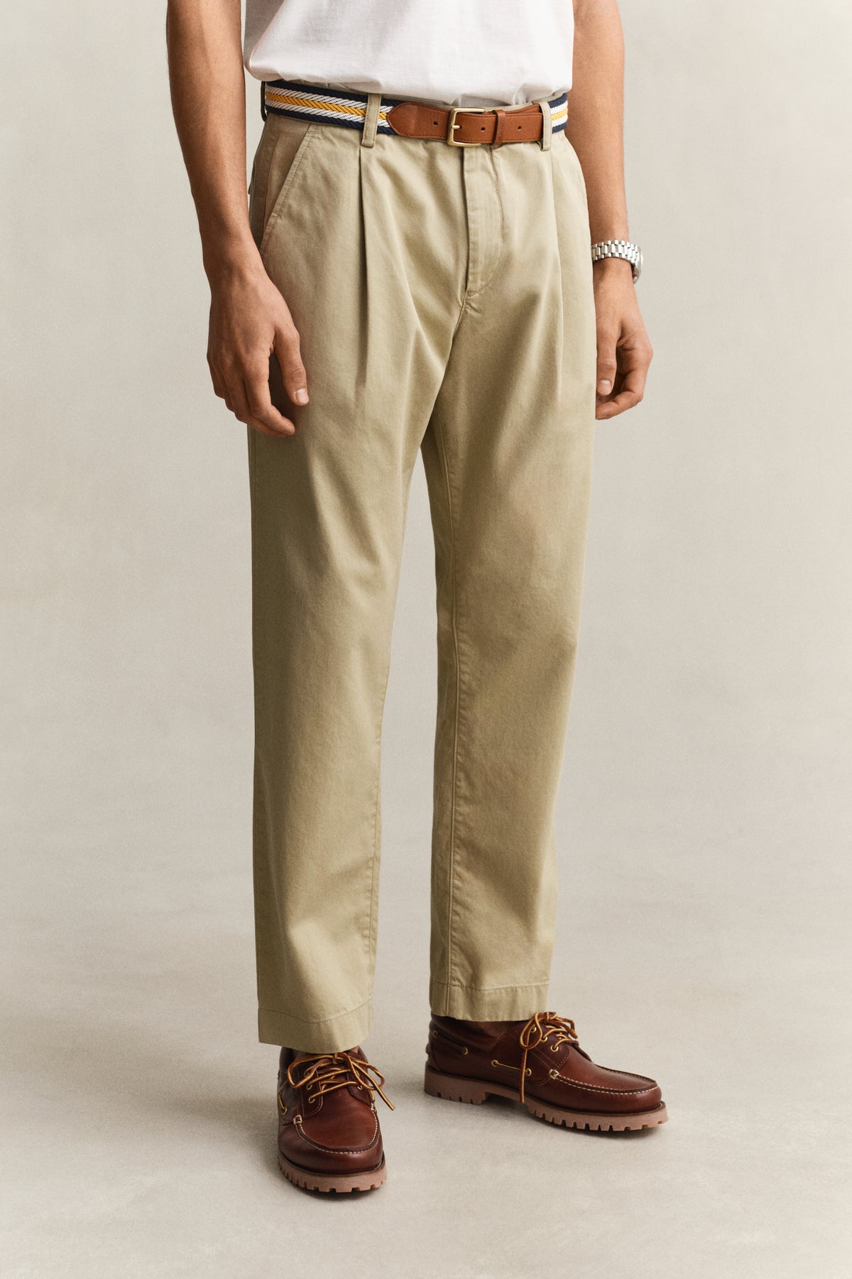 MODEL WEARING REG PLEATED COTTON TWILL CHINOS