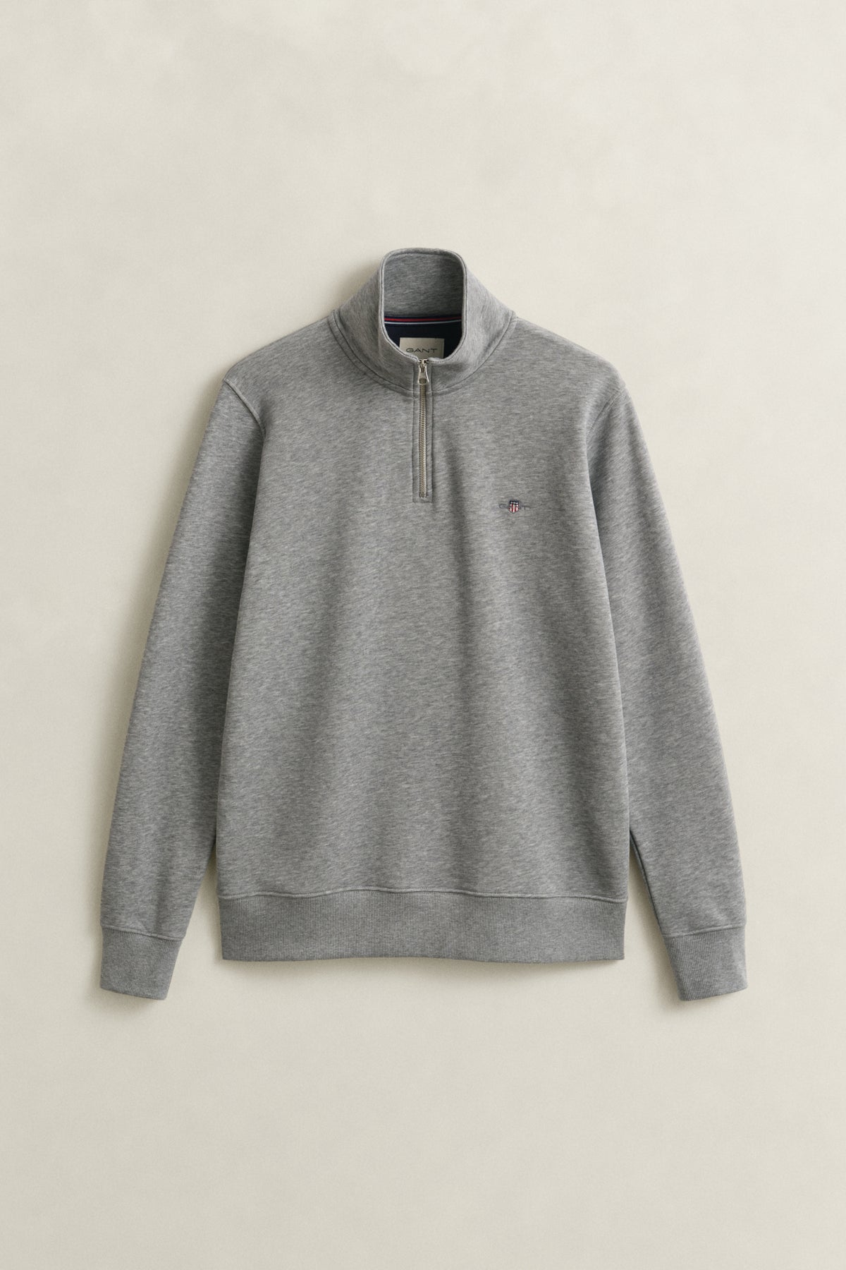GREY MELANGE, REG SHIELD HALF ZIP SWEAT, FLAT-LAY BY GANT AU.