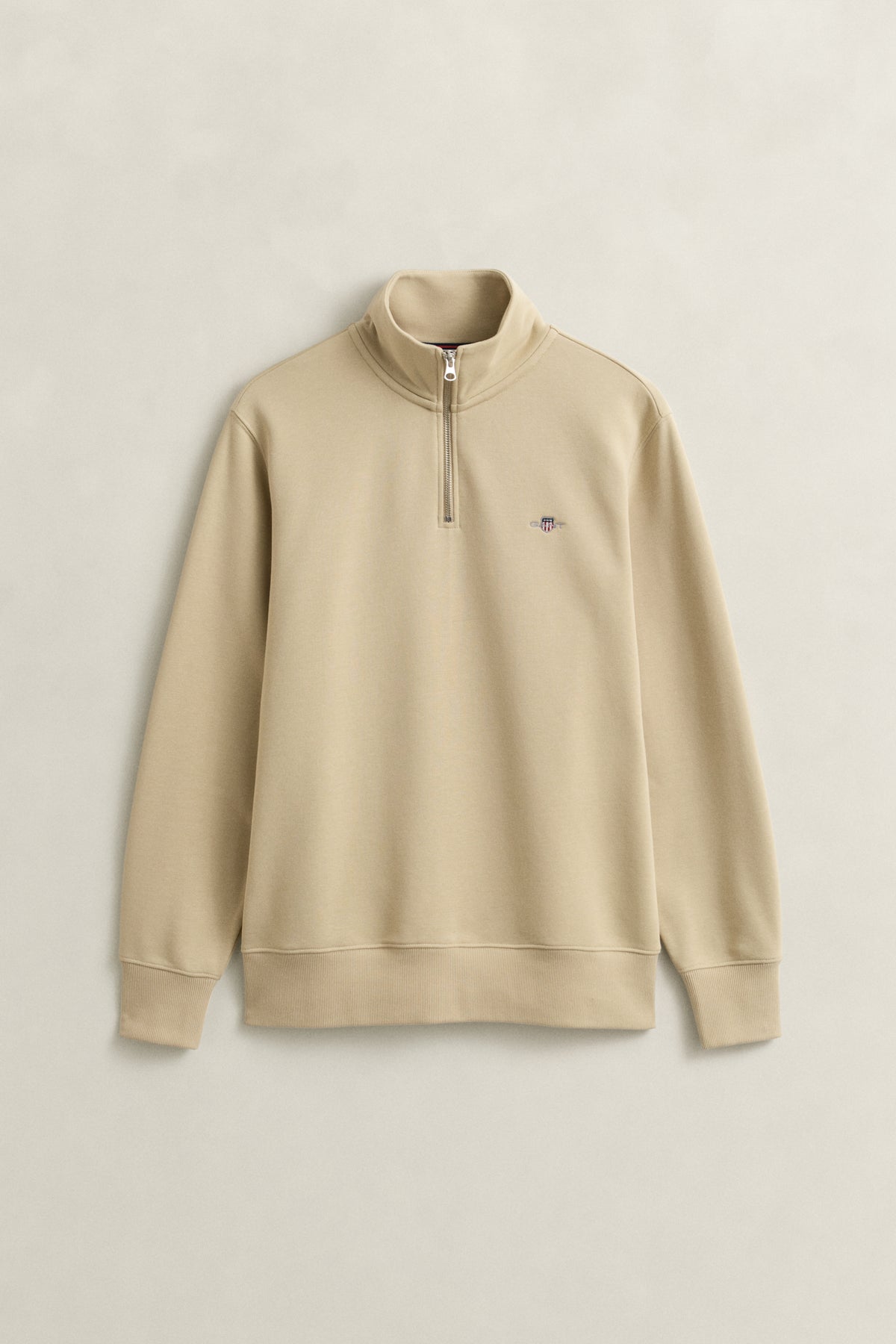 OAT BEIGE, REG SHIELD HALF ZIP SWEAT, FLAT-LAY BY GANT AU.