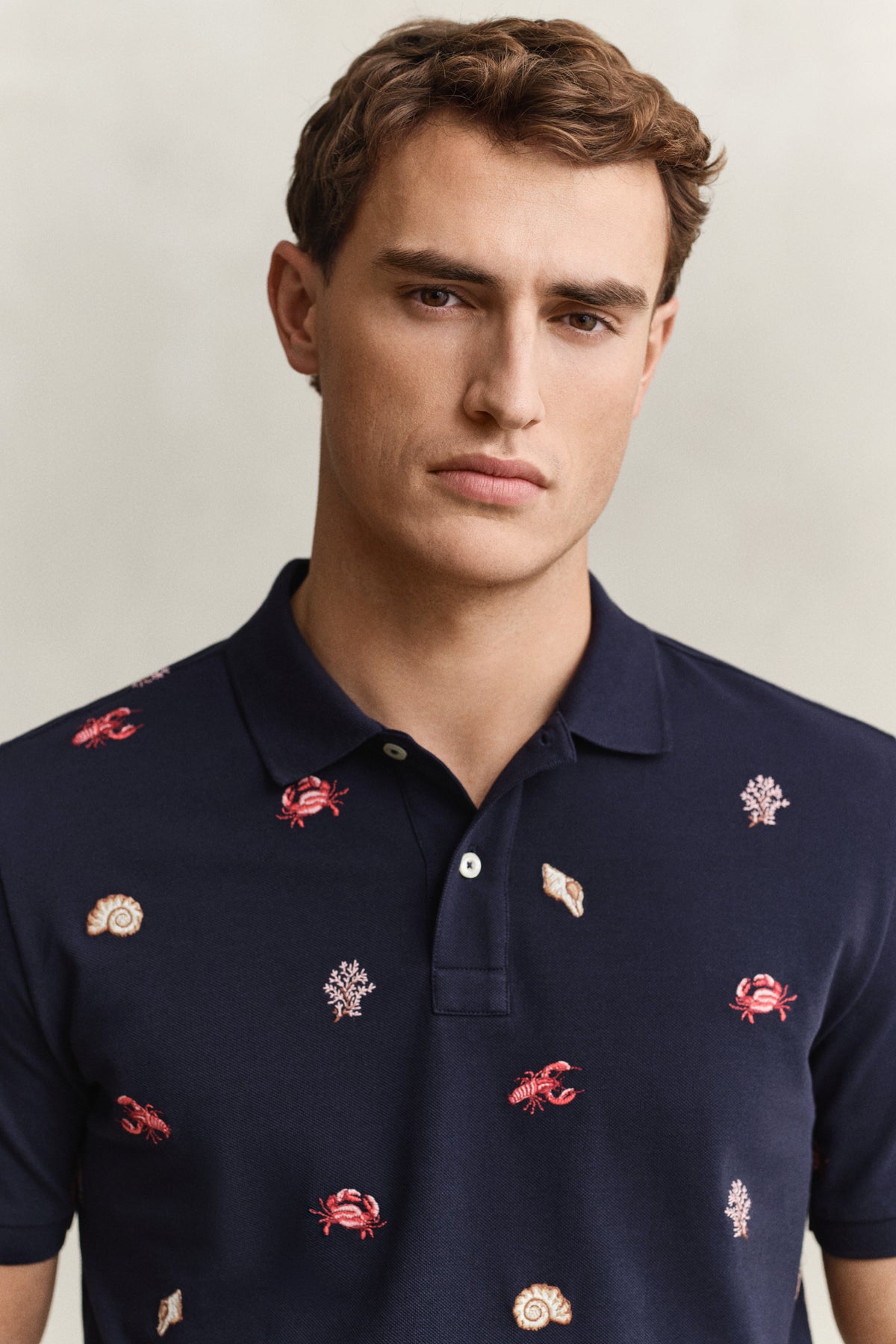 MODEL WEARING EMBROIDERED SS POLO