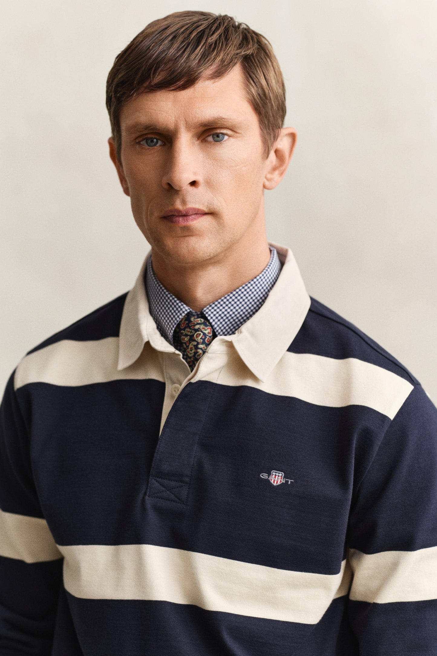 MODEL WEARING STRIPED RUGGER