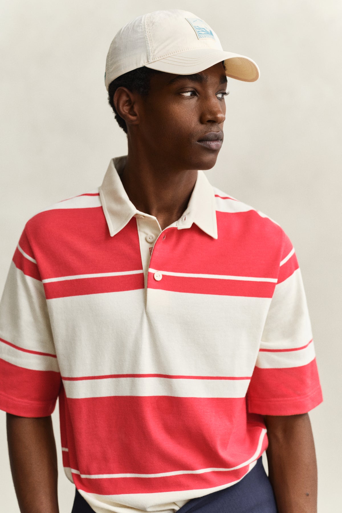 MODEL WEARING STRIPED SS RUGGER