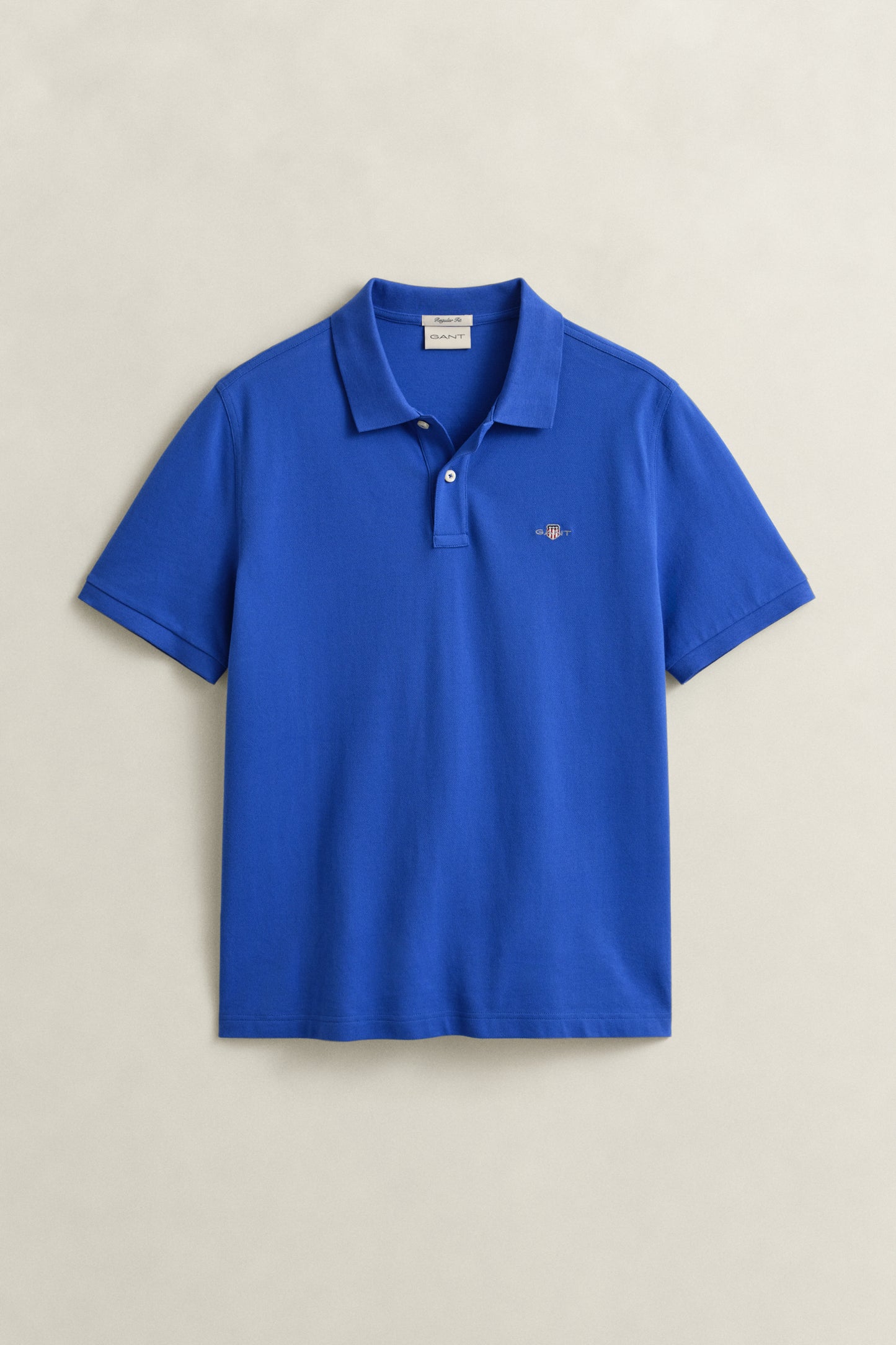 ROYAL BLUE, REG SHIELD SS PIQUE POLO, FLAT-LAY BY GANT AU.