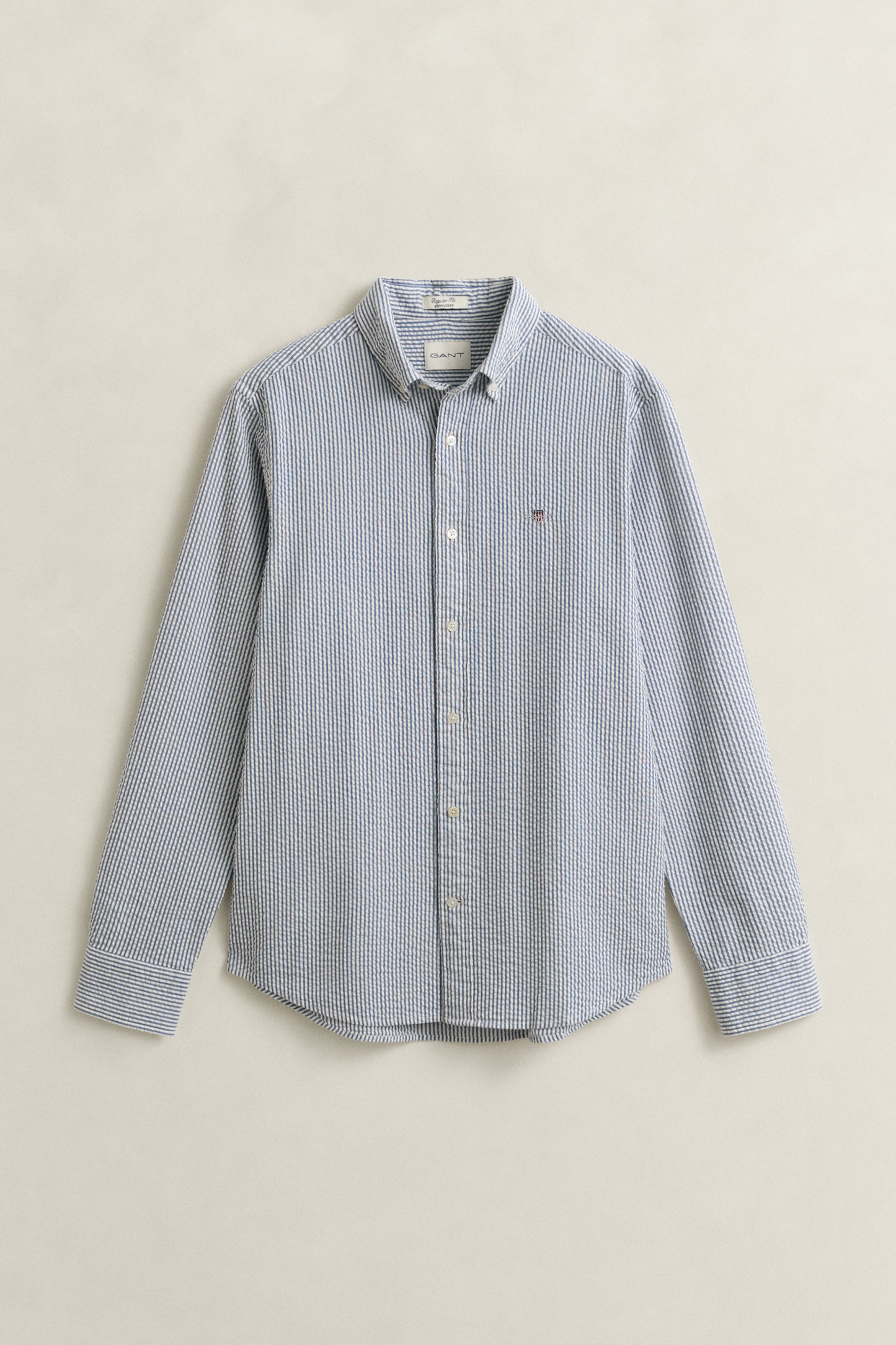 VINTAGE BLUE, REG SEERSUCKER STRIPE SHIRT, FLAT-LAY BY GANT AU.