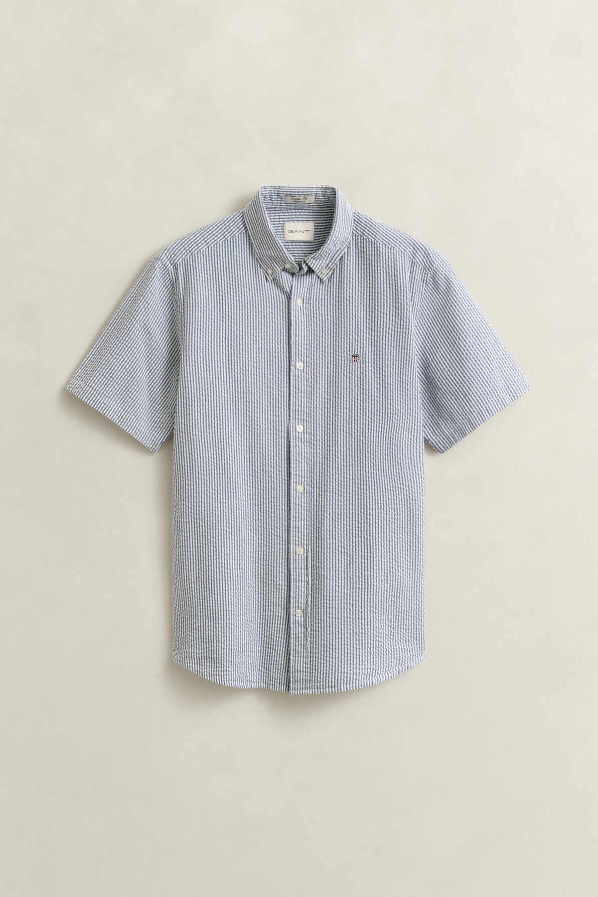 VINTAGE BLUE, REG SEERSUCKER STRIPE SS SHIRT, FLAT-LAY BY GANT AU.