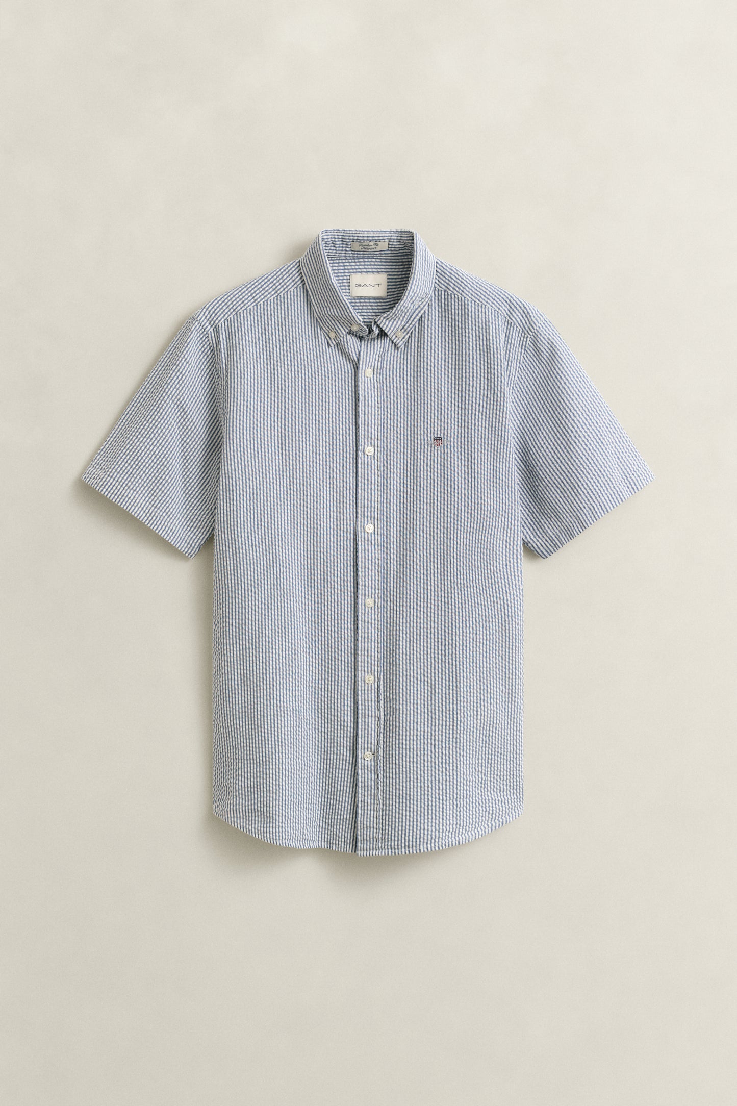 VINTAGE BLUE, REG SEERSUCKER STRIPE SS SHIRT, FLAT-LAY BY GANT AU.