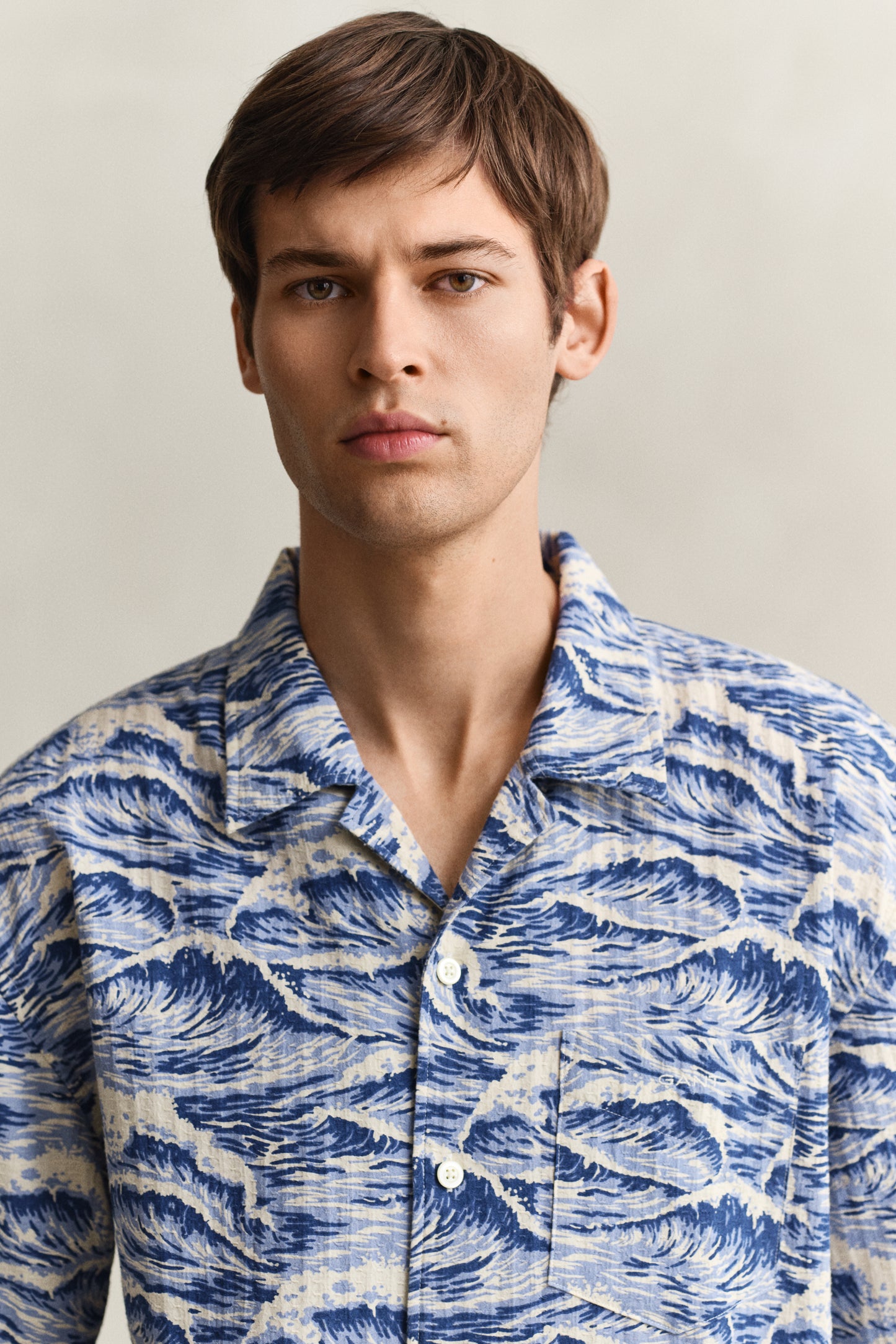 MODEL WEARING REL AOP CAMP COLLAR SS SHIRT