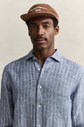 MODEL WEARING REG LINEN STRIPE SHIRT