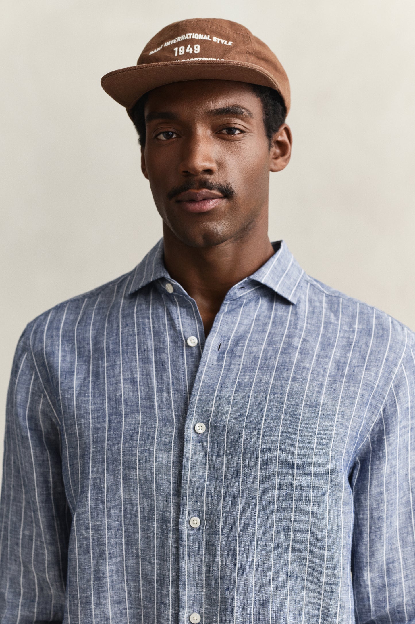 MODEL WEARING REG LINEN STRIPE SHIRT