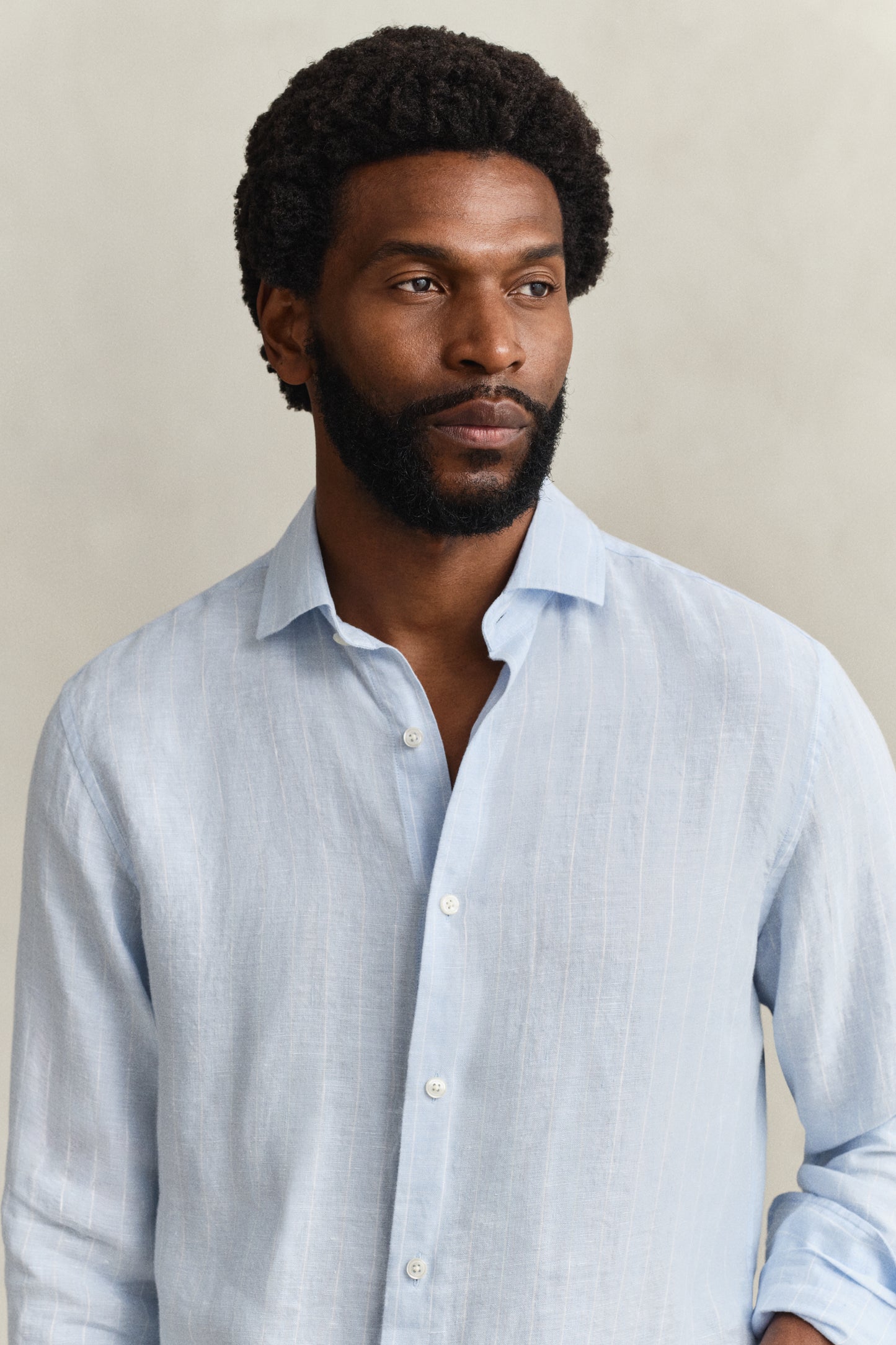 MODEL WEARING REG LINEN STRIPE SHIRT