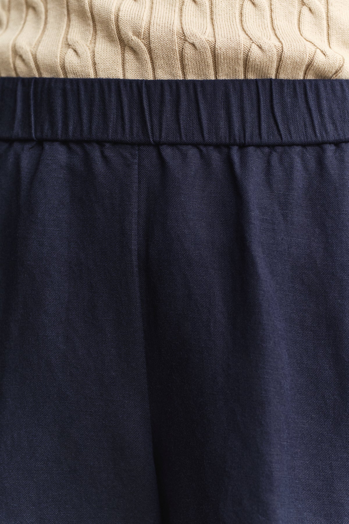 MODEL WEARING LINEN BLEND PULL ON SHORTS