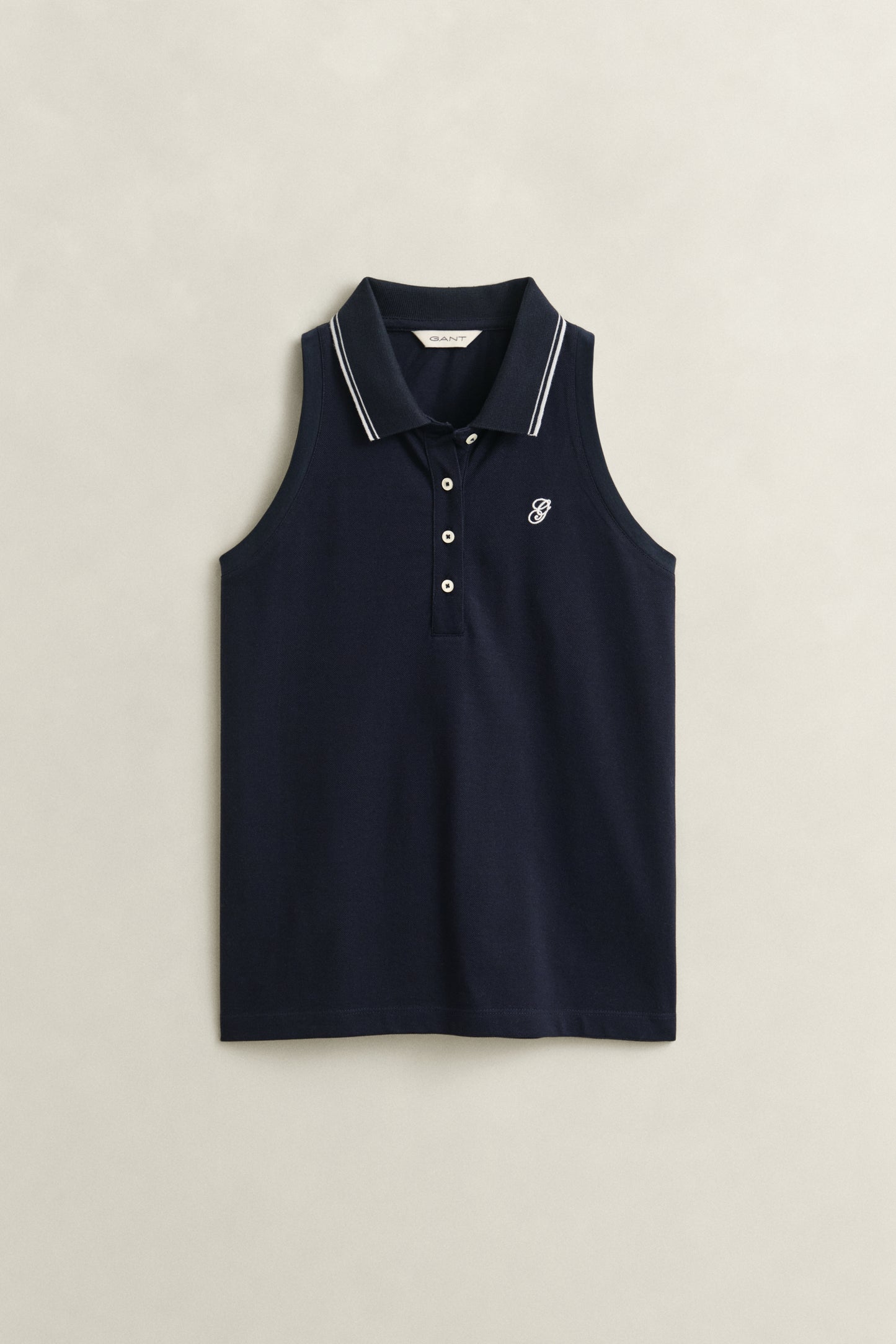 EVENING BLUE, REG SLEEVELESS PIQUE POLO, FLAT-LAY BY GANT AU.
