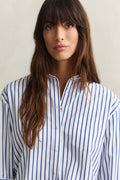 MODEL WEARING REL CLASSIC POPLIN STRIPED SHIRT