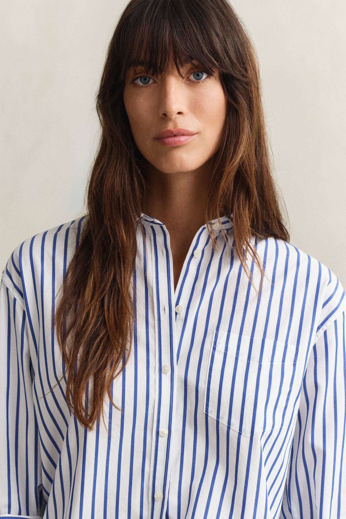 MODEL WEARING REL CLASSIC POPLIN STRIPED SHIRT