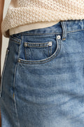 MODEL WEARING DENIM SHORT SKIRT