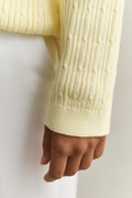 MODEL WEARING CABLE KNIT V-NECK