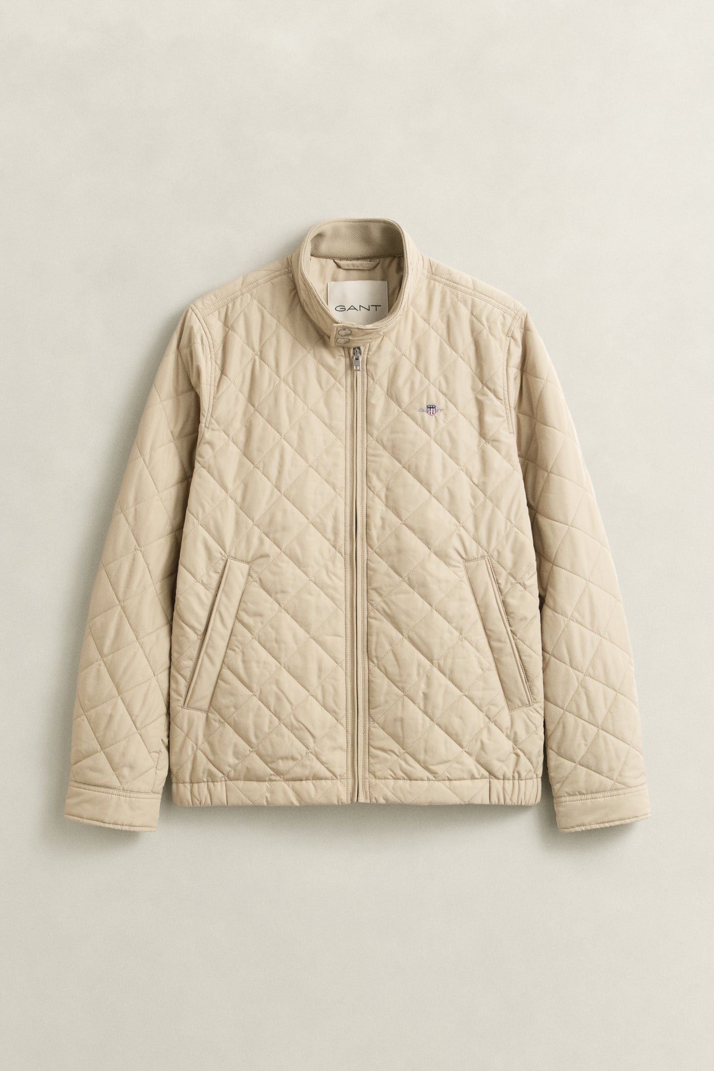 OAT BEIGE, QUILTED WINDCHEATER, FLAT-LAY BY GANT AU.