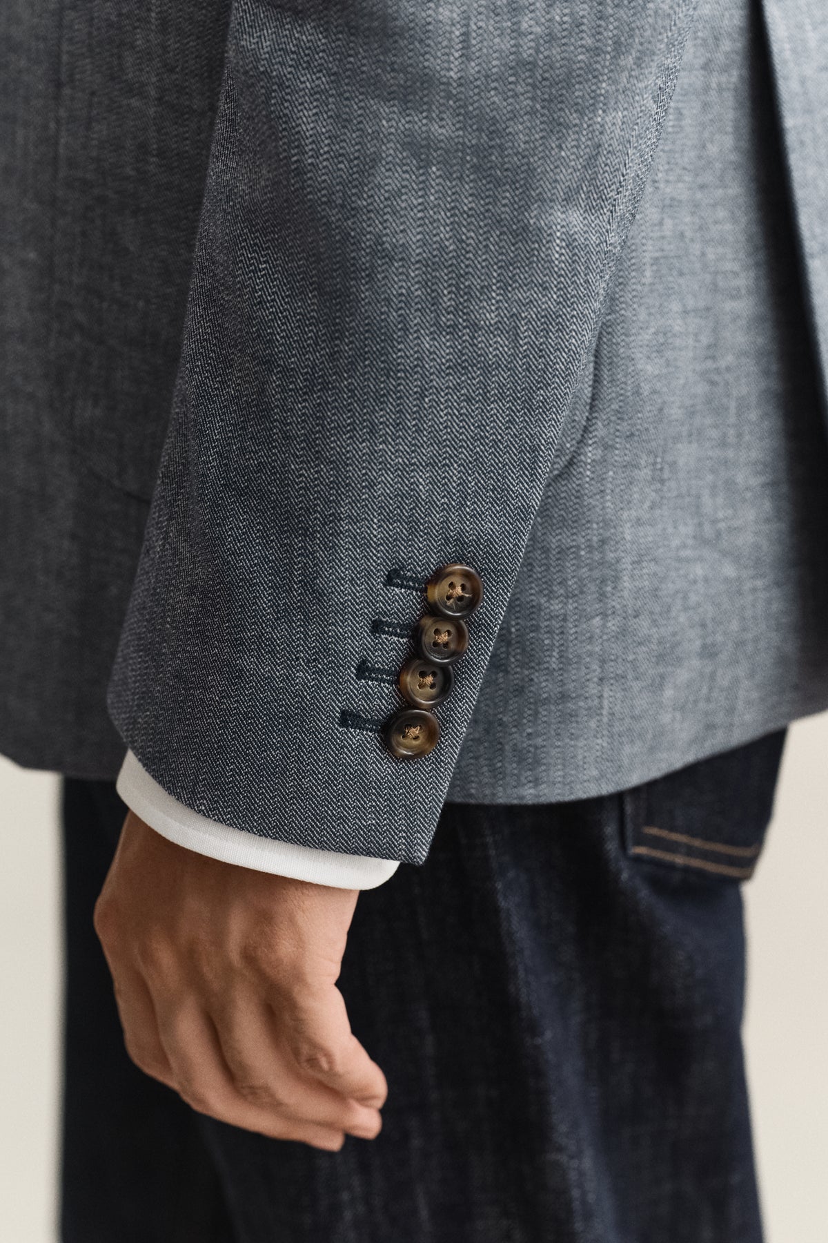 MODEL WEARING INDIGO HERRINGBONE SUIT JACKET