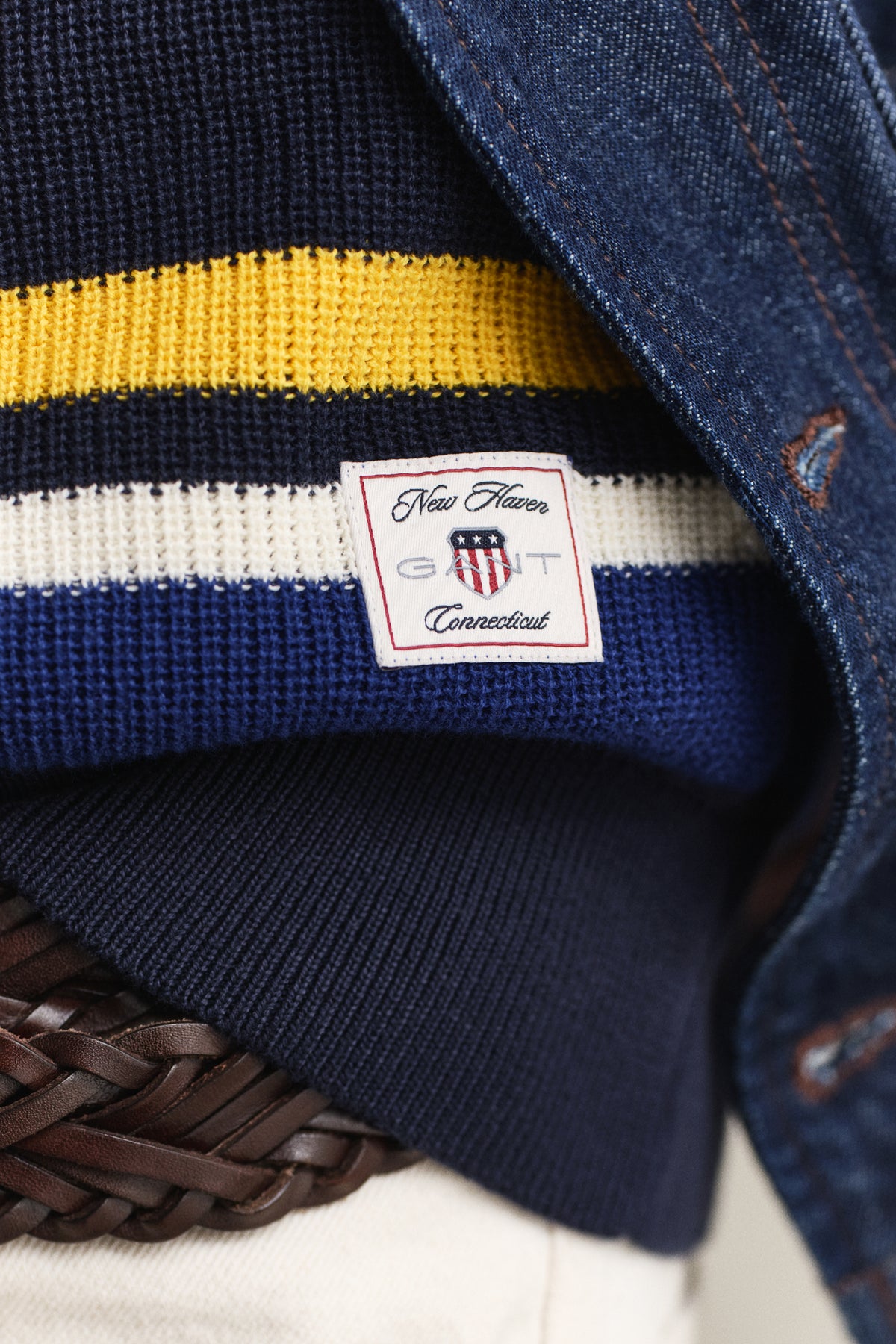 MODEL WEARING STRIPED COTTON RIB POLO