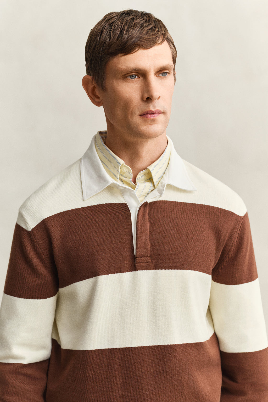 MODEL WEARING BARSTRIPED COTTON POLO