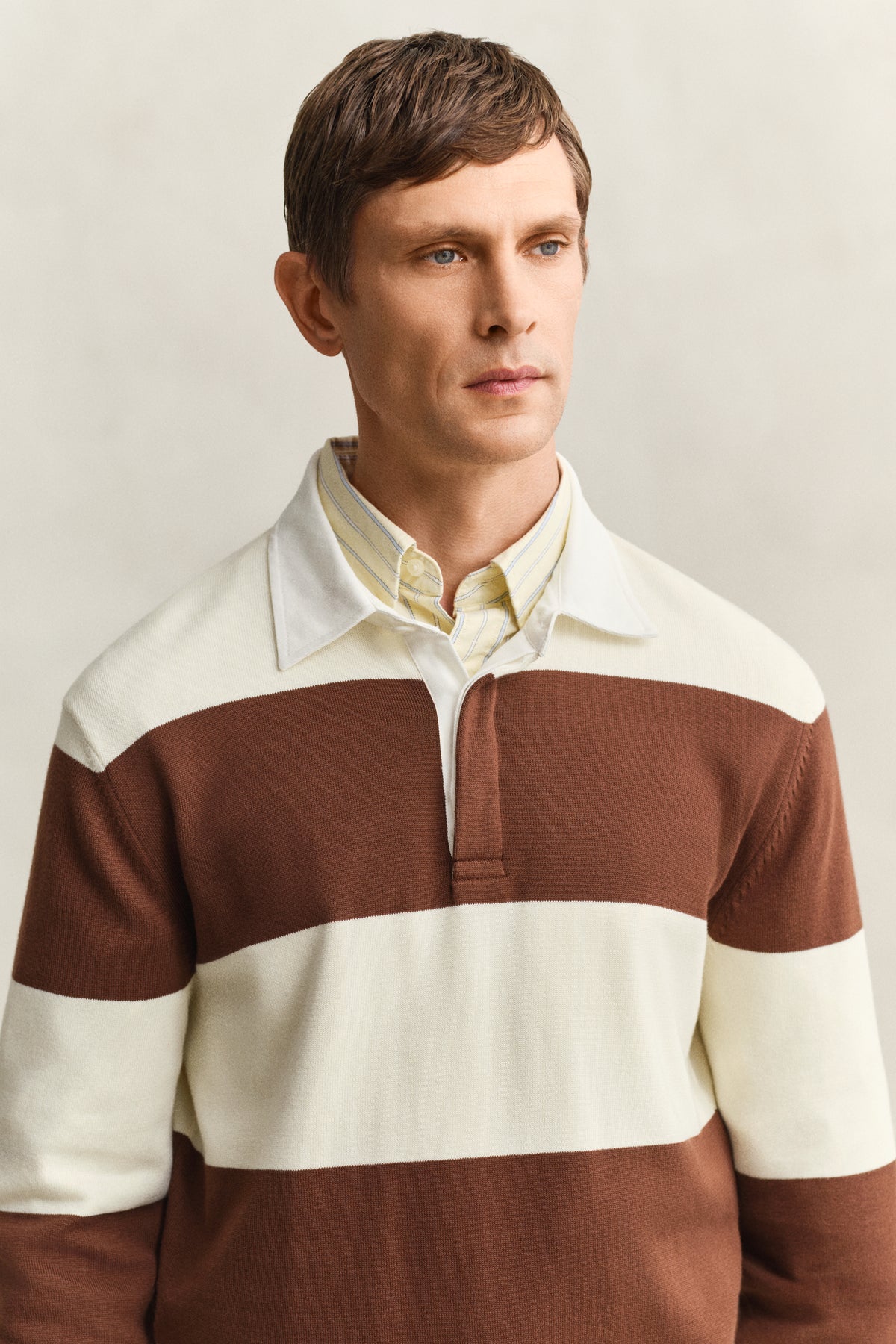 MODEL WEARING BARSTRIPED COTTON POLO