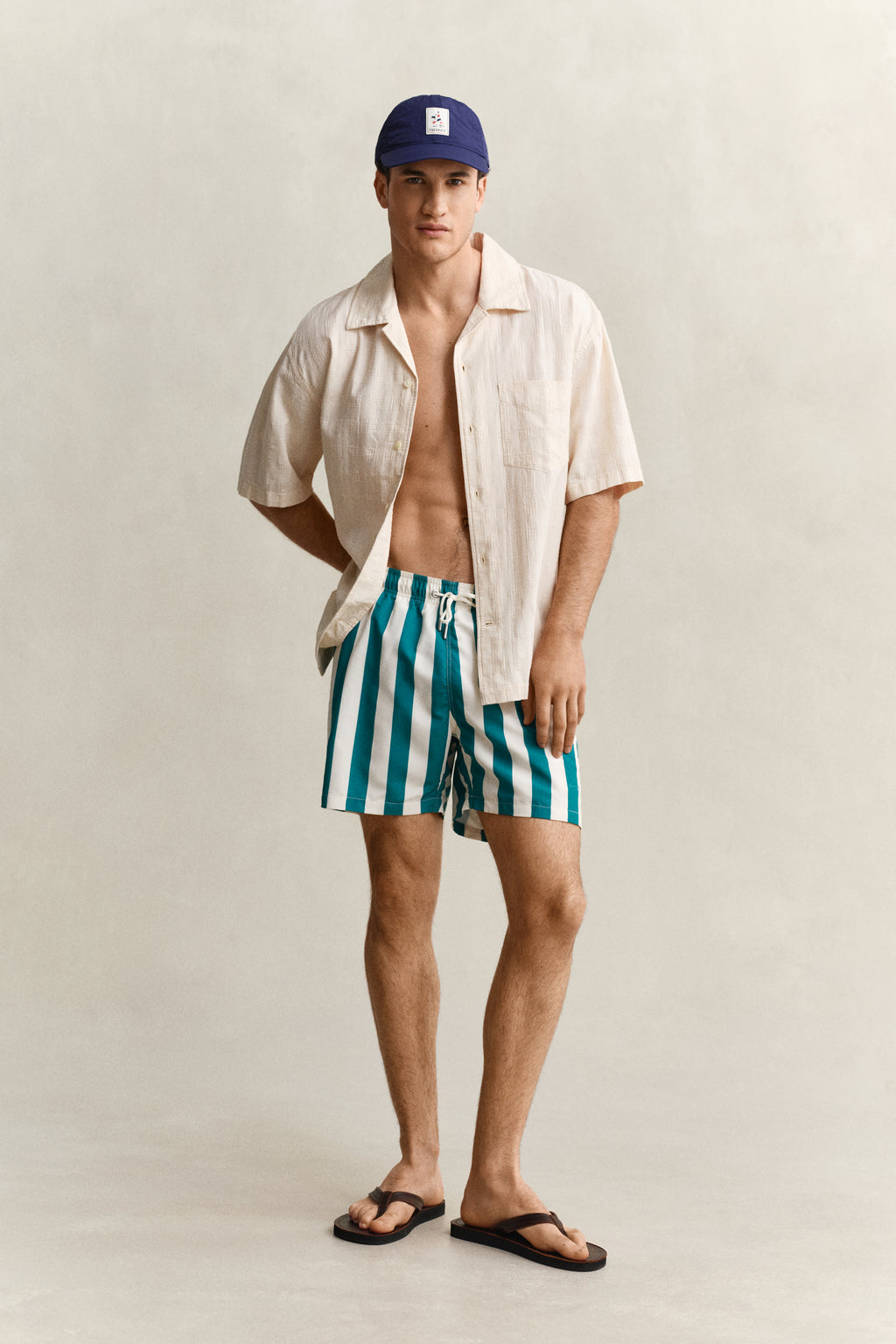 AQUA BLUE, BLOCK STRIPED SWIM SHORTS BY GANT AU.