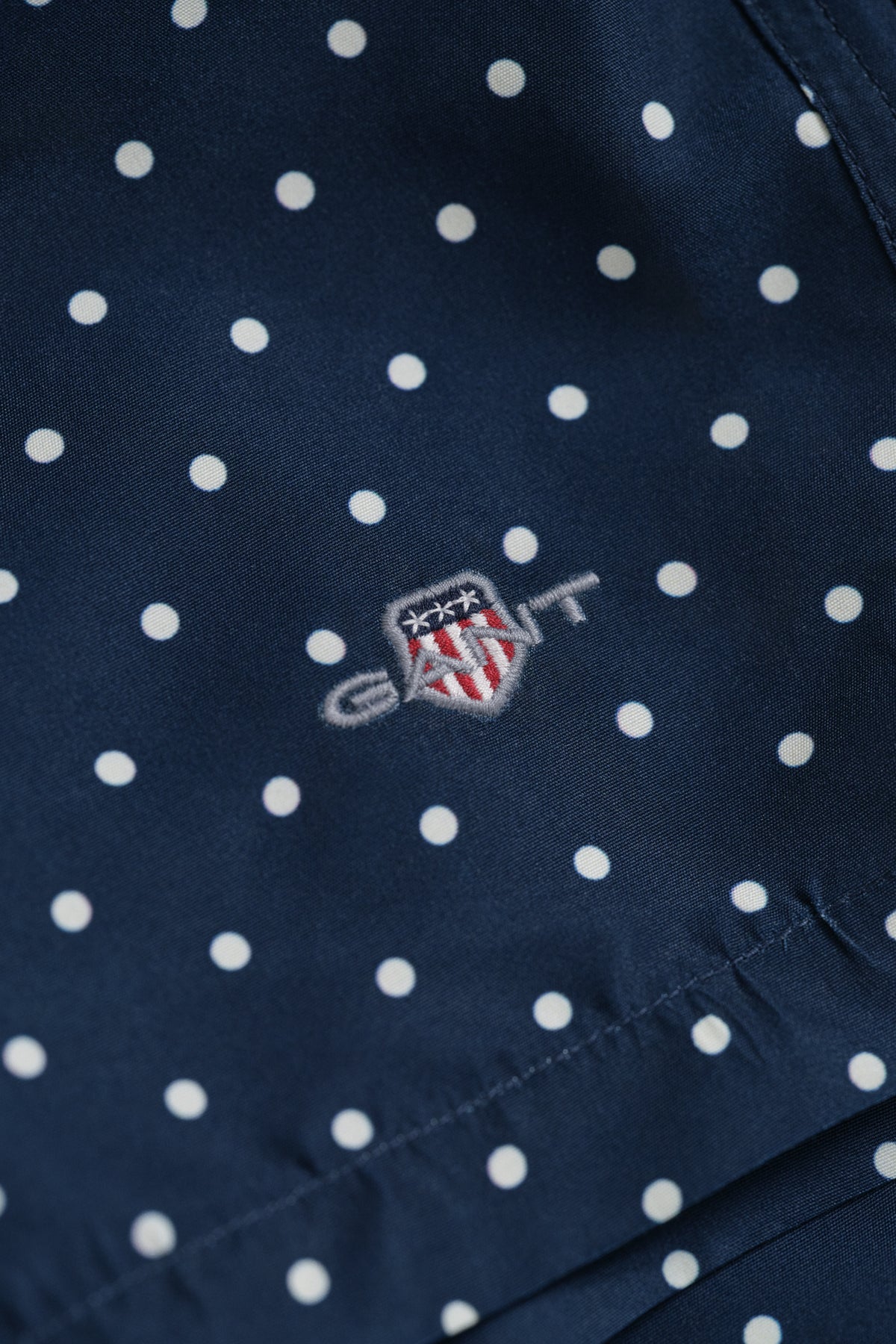 MARINE, DOT PRINT SWIM SHORTS, FLAT-LAY BY GANT AU.