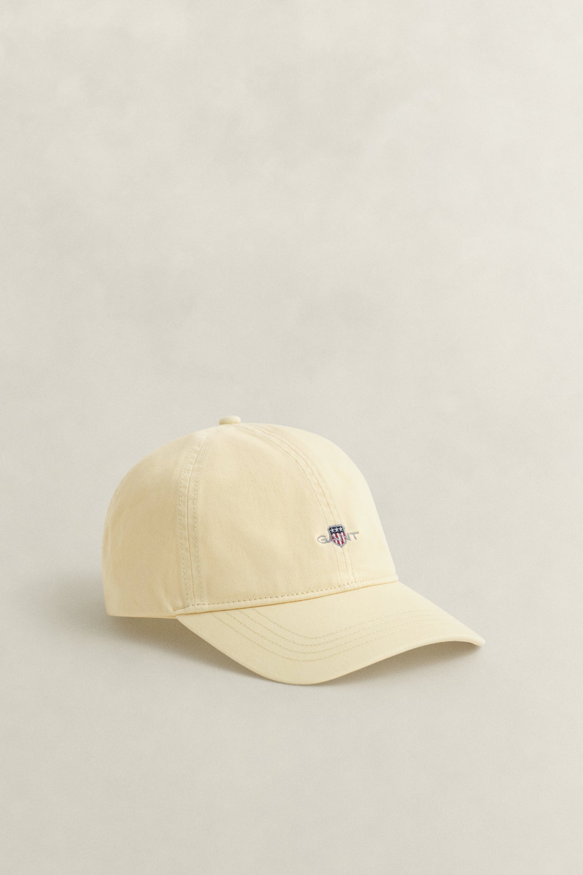 VANILLA YELLOW, SHIELD SUNFADED CAP, FRONT-VIEW BY GANT AU.