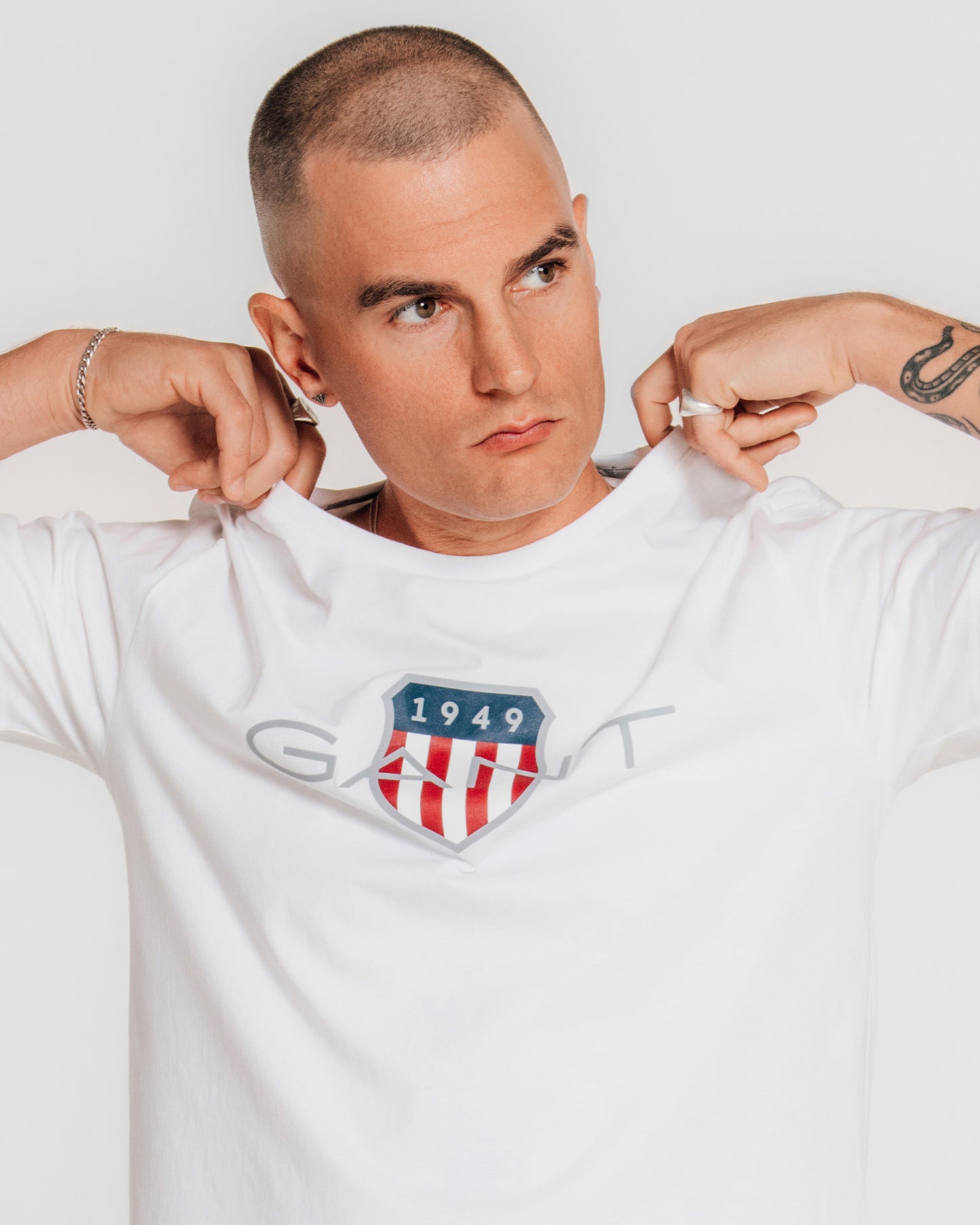 MODEL WEARING REG ARCHIVE SHIELD TSHIRT